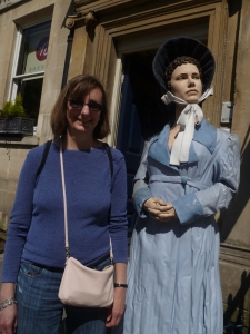 Mom with the statue of Jane Austen outside the house.