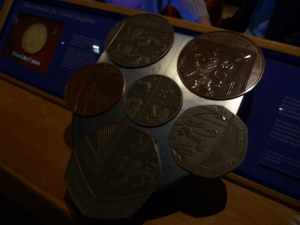The British coins arranged on the Royal Shield